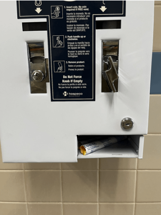Picture of a broken knob on dispenser in the new wing