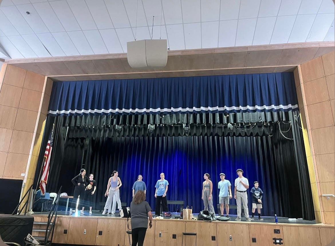 The cast of Annie learning the song "Hard-Knock Life".